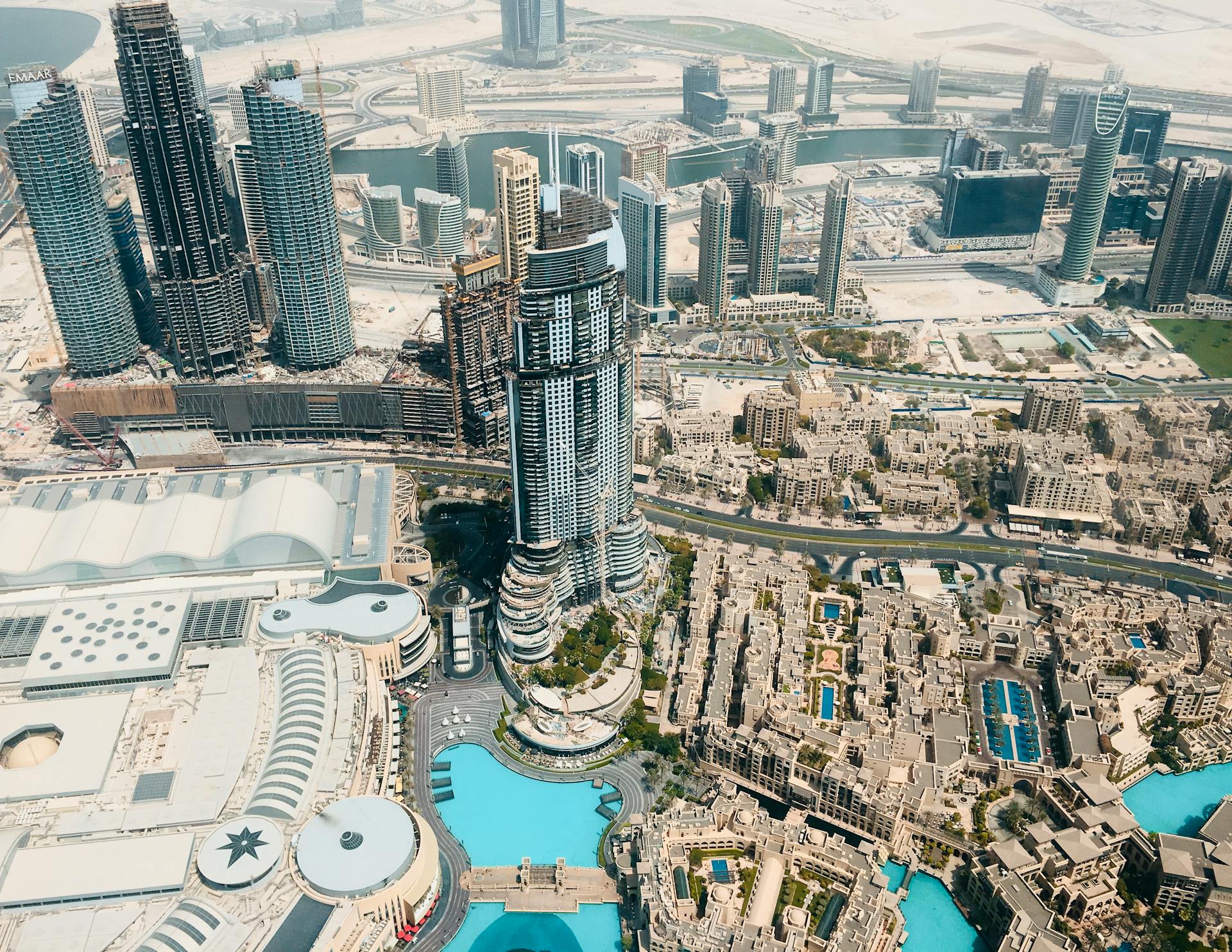 High-angle aerial shot of Downtown Dubai showcasing modern skyscrapers and urban landscape.