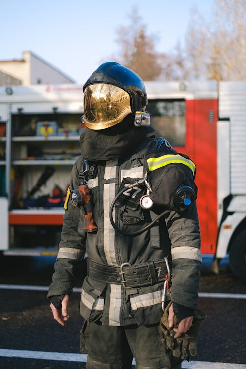 A Firefighter in Uniform Standing