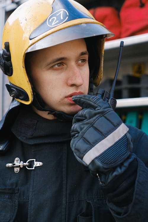 Free Firefighter Talking on a Transceiver Stock Photo