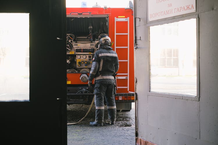 Fireman Preparing Equipment