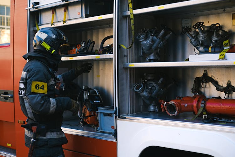 Firefighter With Fire Engine Equipment 