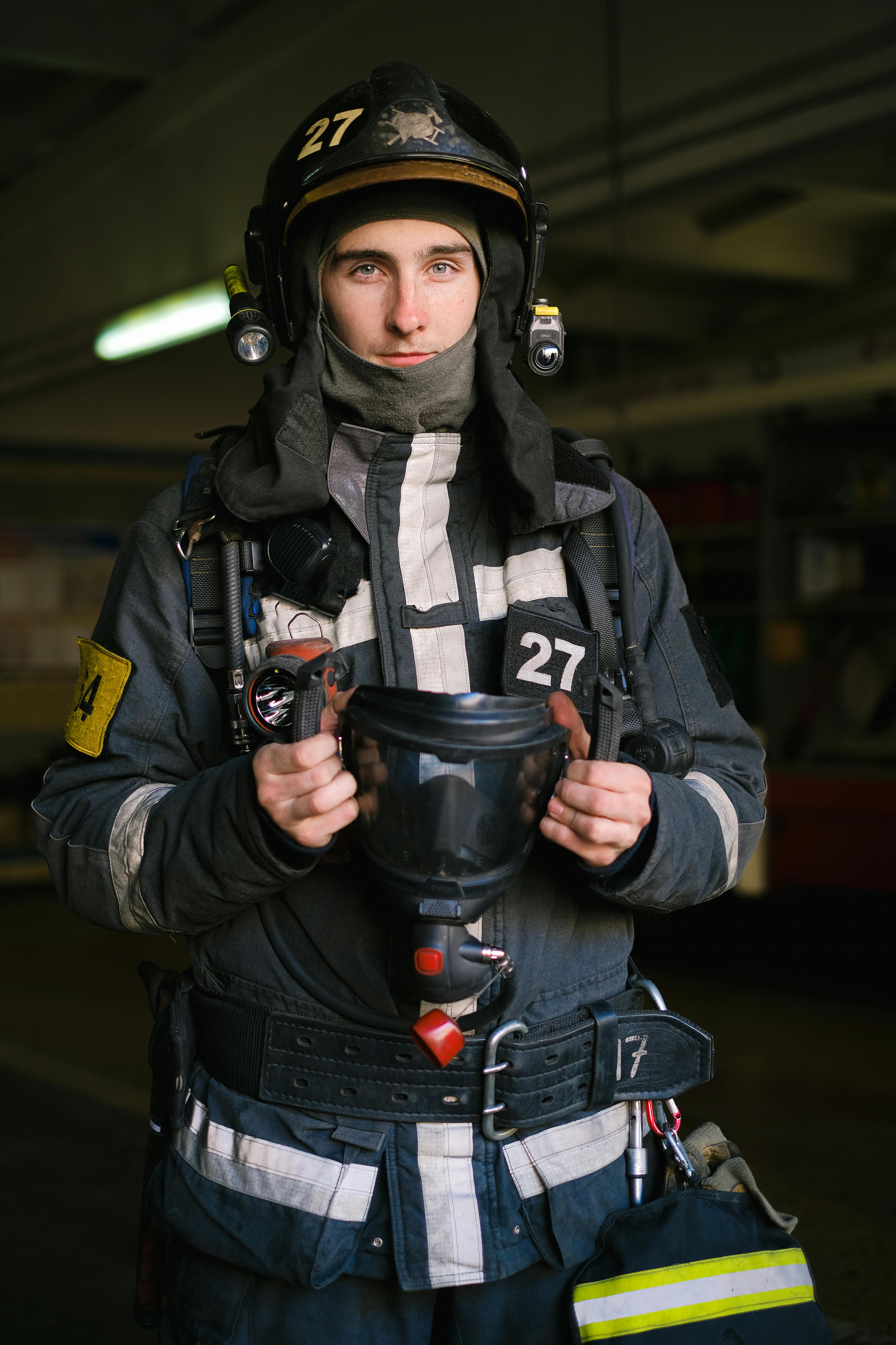 portrait of firefighter with mask in hand