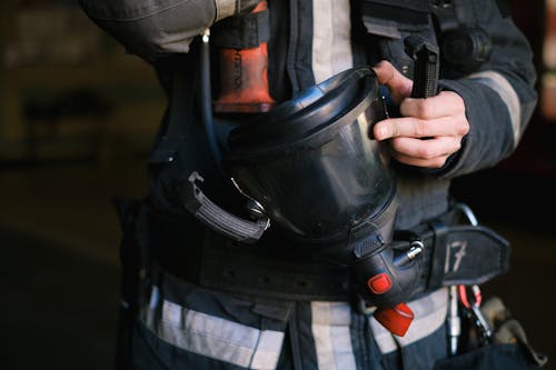 Gratis stockfoto met brandweerman, bunkeruitrusting, detailopname