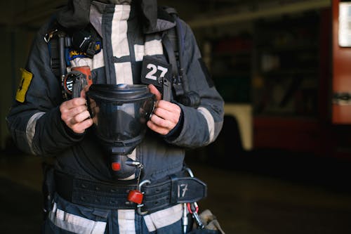 Free Fire Fighter Holding a Gas Mask Stock Photo