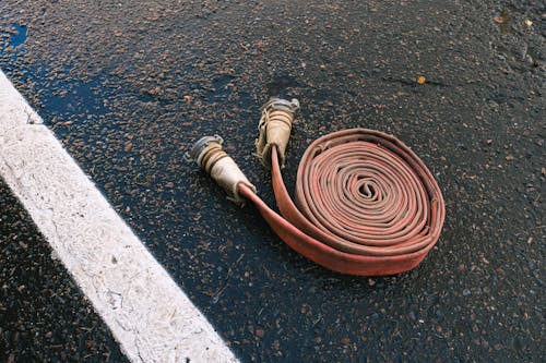 Free Photo of an Extension Fire Hose on Road Stock Photo