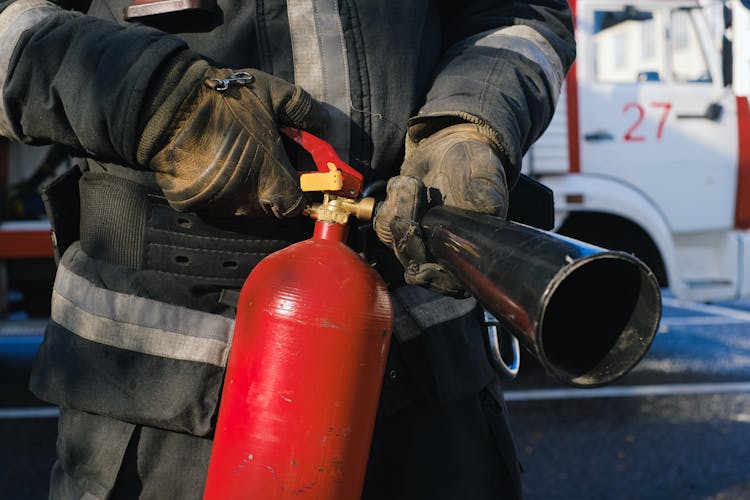 Firefighter Holding Fire Extinguisher