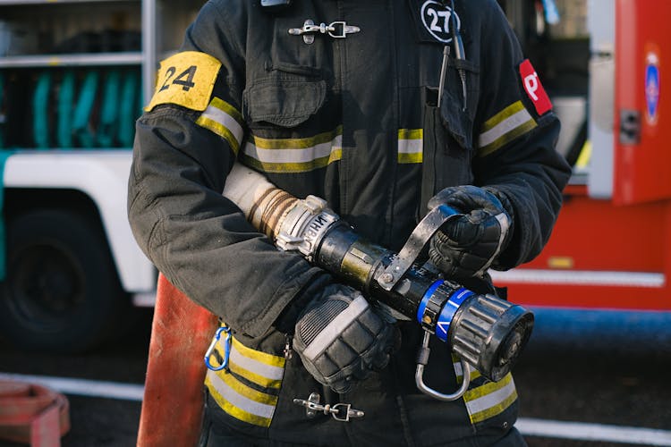 Fireman Holding A Hose