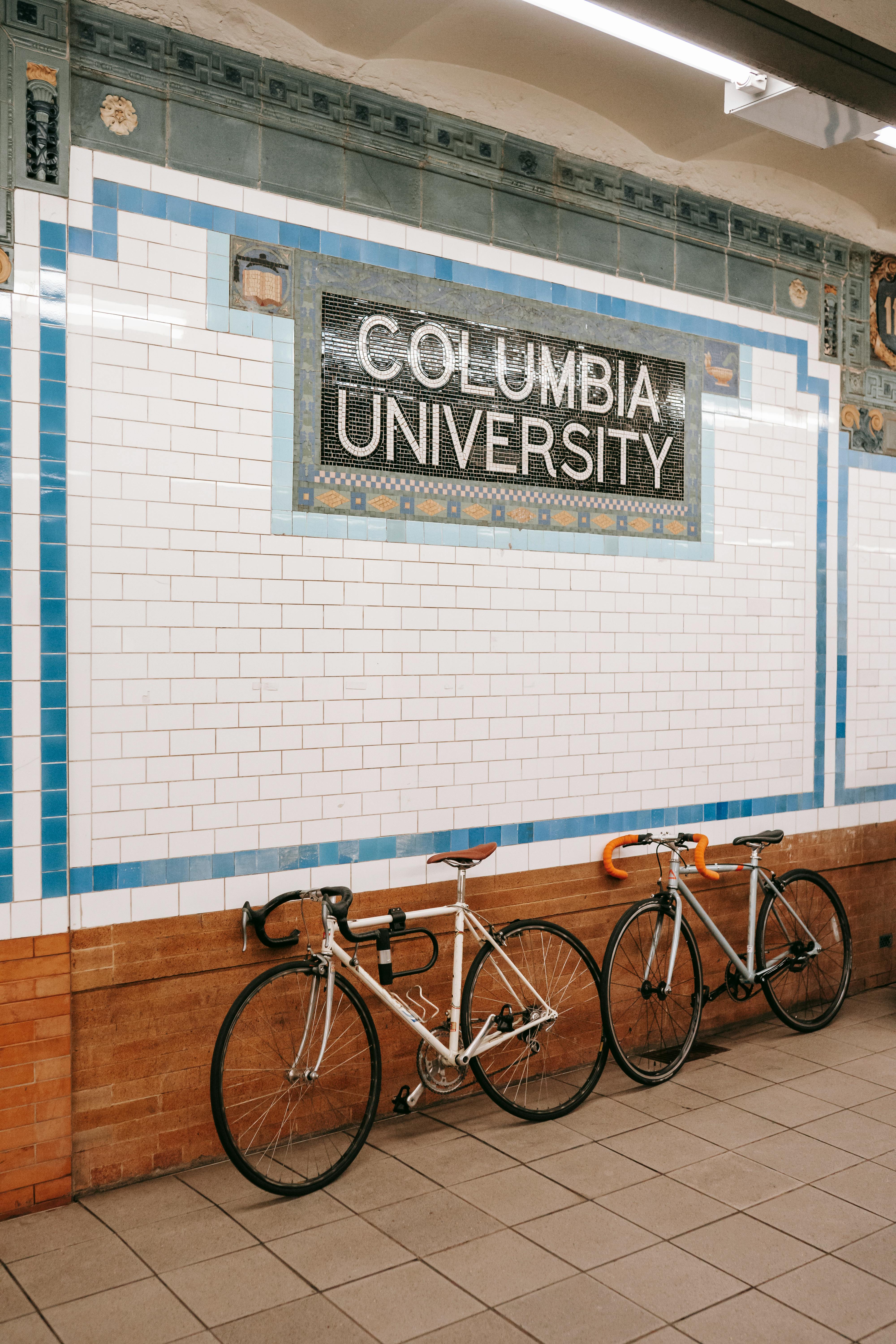 bicycles parked near wall in subway station