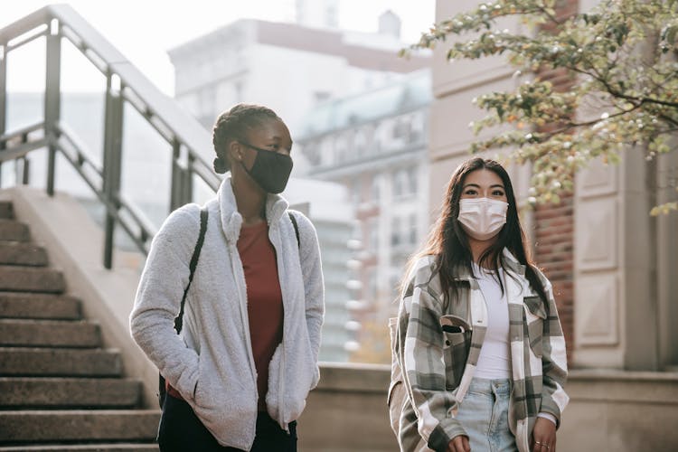 Multiethnic Students Walking In University Campus