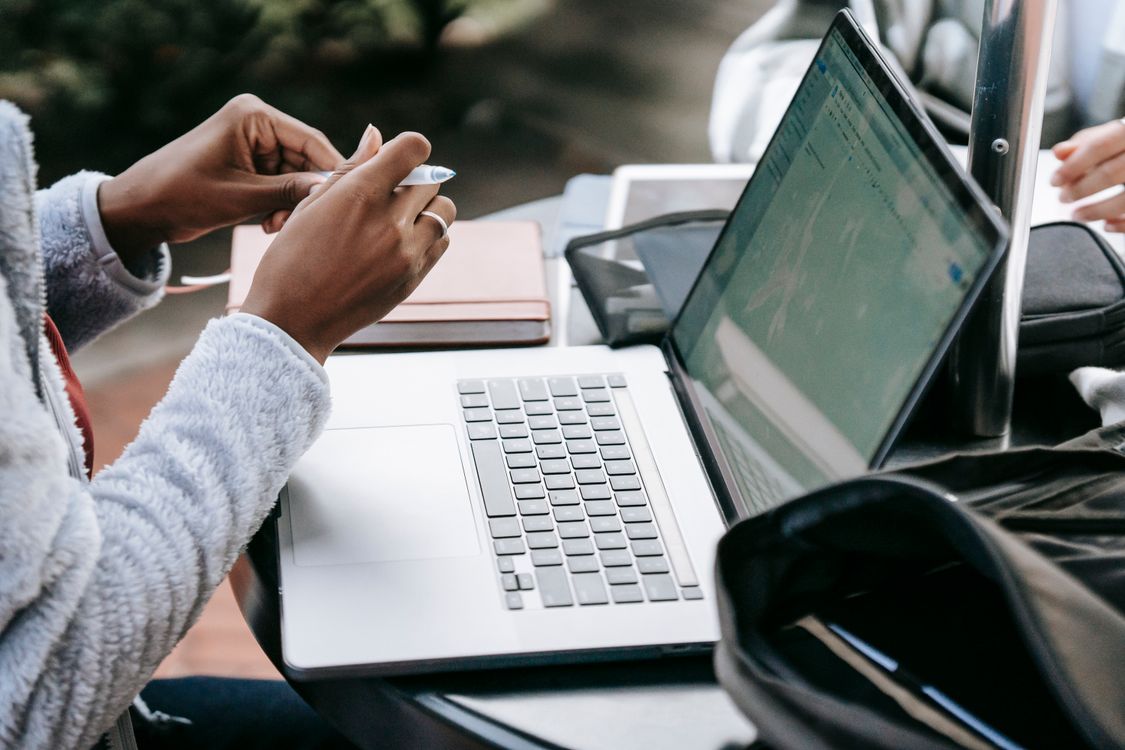 Crop diverse students working on task together · Free Stock Photo