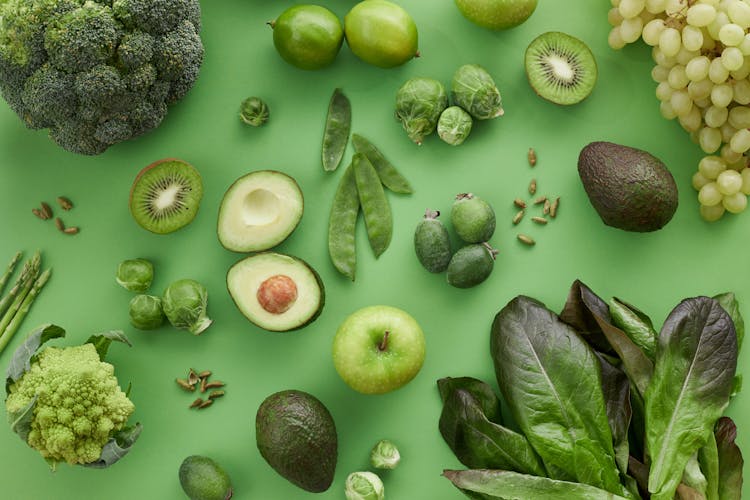 Assorted Vegetables And Fruits On Green Surface