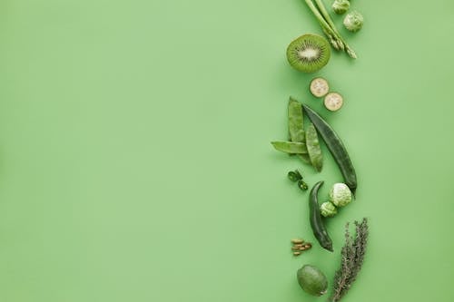 Free Green Fruit and Vegetables on Green Surface Stock Photo