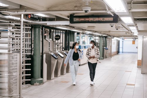 Diverse women walking in spacious underground