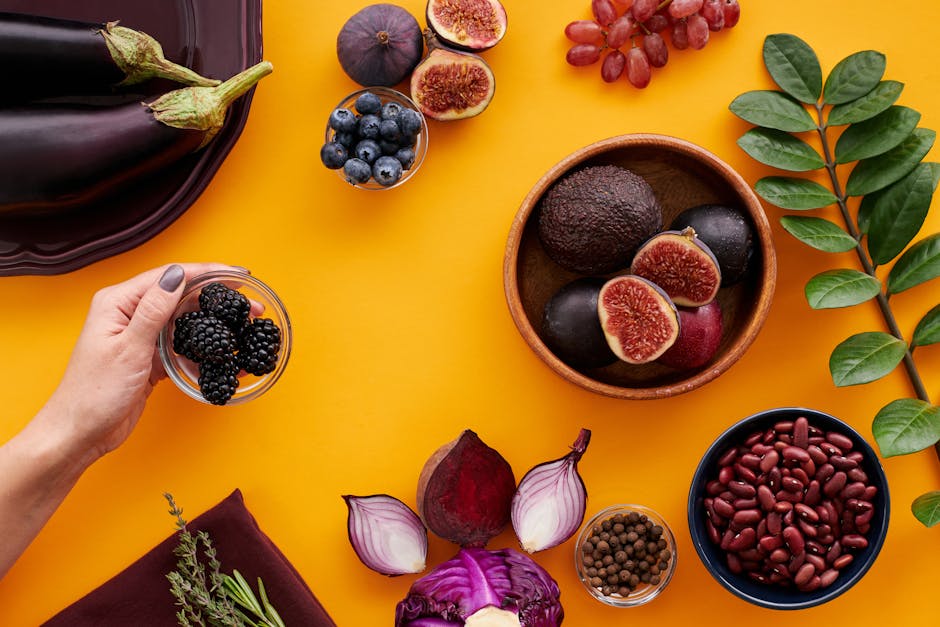 Kuinka käyttää punajuurta arjessa Kuinka käyttää punajuurta arjessa - Colorful assortment of fruits and vegetables on a yellow backdrop, highlighting healthy e