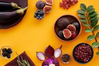 Purple and Brown Round Fruits on Brown Round Plate