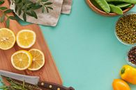 Sliced Orange Fruit Beside White Textile