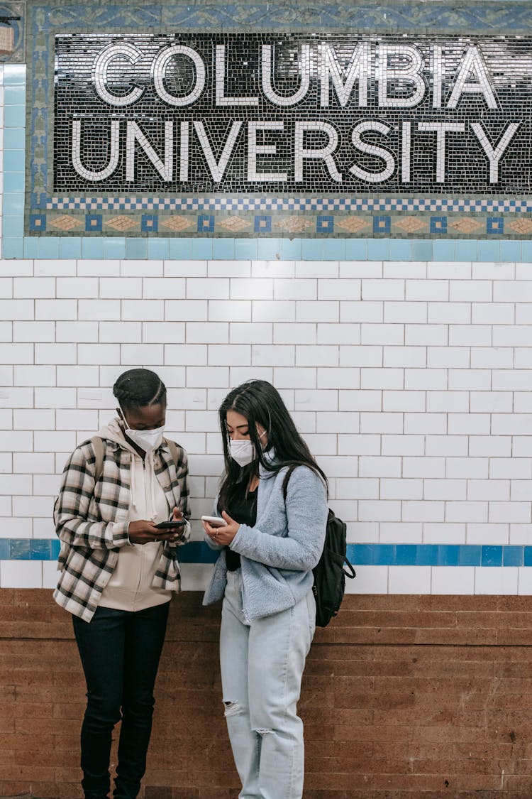 Young Multiracial Women Standing In University