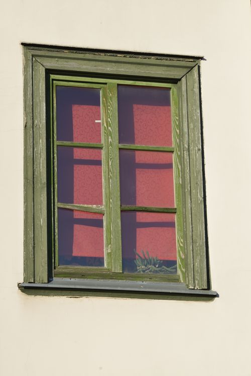 Free Close-up of a vintage wooden window with green frames and indoor plants, Latvia. Stock Photo