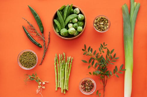 Green Vegetables on an Orange Background