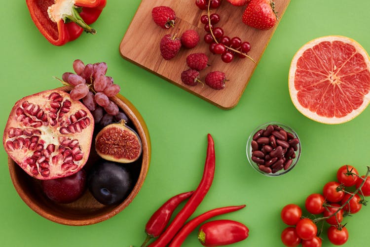 Top View Of Fruits And Vegetables Lying On Green Background 