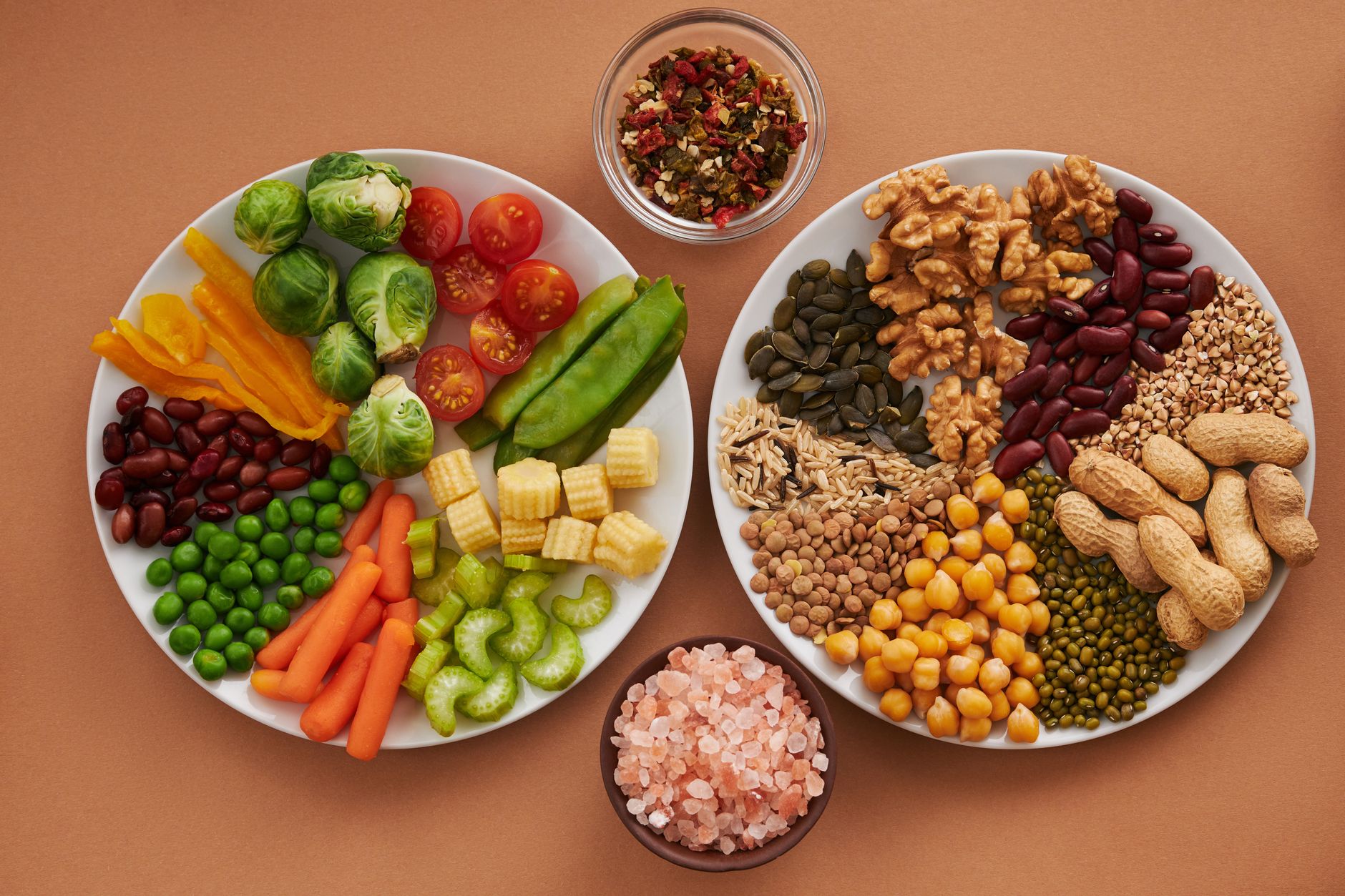 A plate of beans, seeds and vegetables, illustrating the whole-food pattern often contrasted with ultra-processed diets in nutrition research.