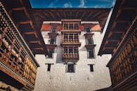 Brown and White Concrete Building Under Blue Sky