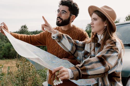 A Couple Holding a Map