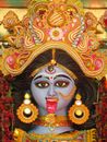 Gold and Red Hindu Deity Figurine
