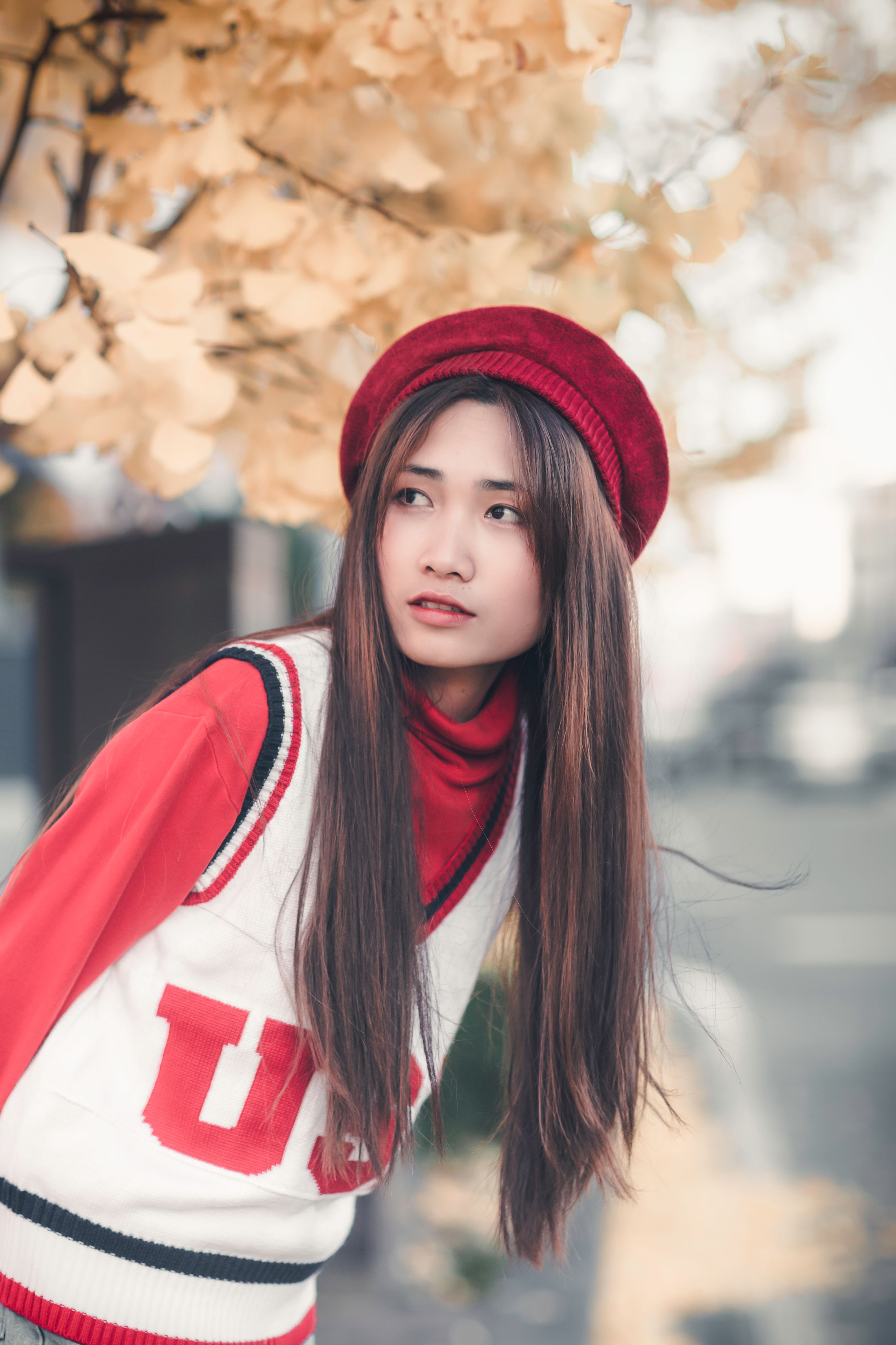 Portrait of a Young Woman with Long Strait Hair Wearing Red Hat · Free ...