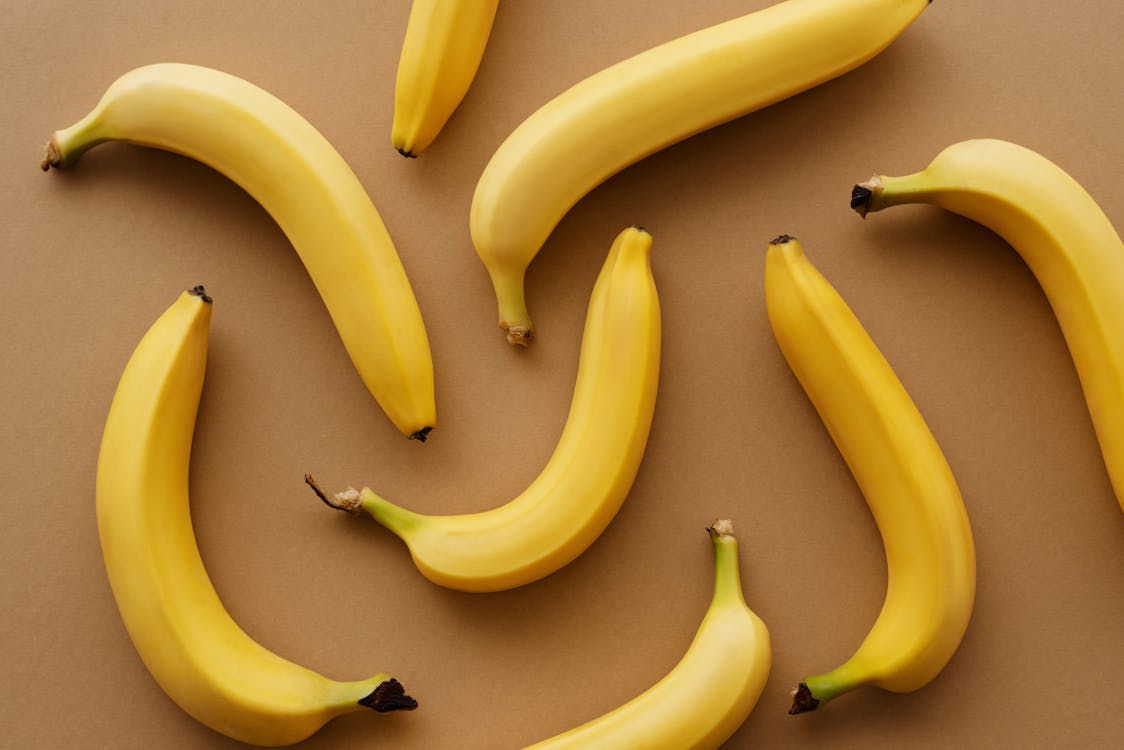 Yellow Banana Fruits on Brown Surface