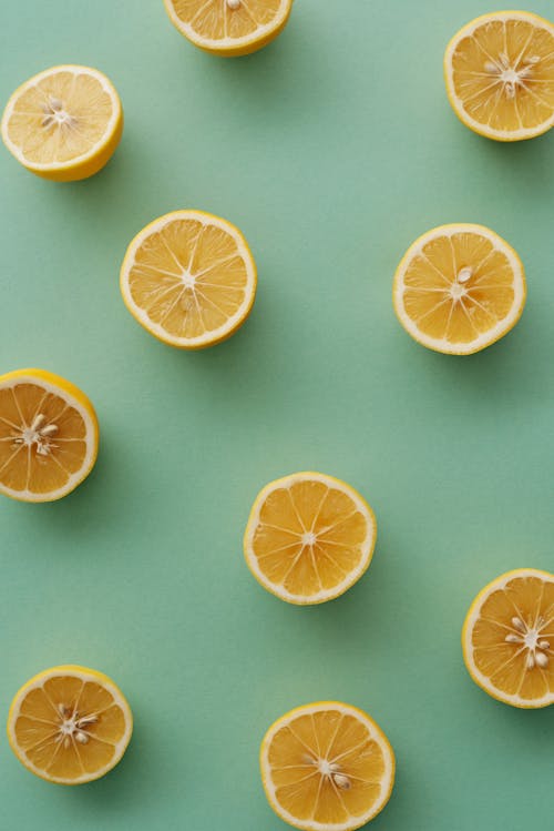 Sliced Lemon Fruits on Blue Surface