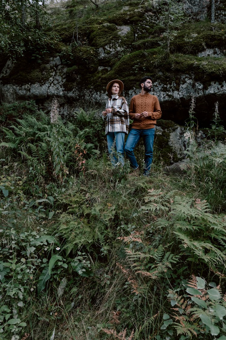 A Couple Traveling Together In The Forest