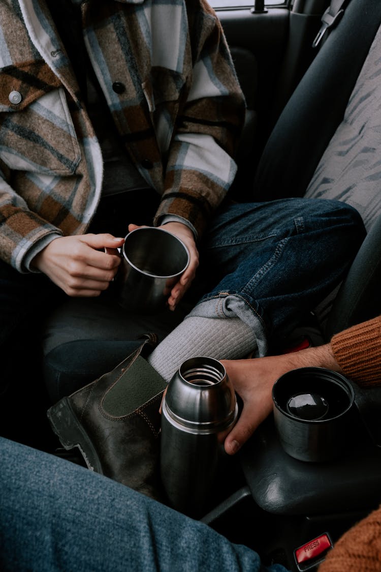 Couple Drinking Coffee In The Car