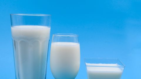 Three types of milk glasses on a blue backdrop, illustrating variety.