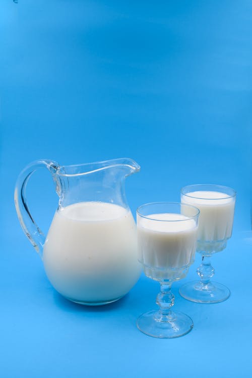 Clear Glass of Pitcher with Milk