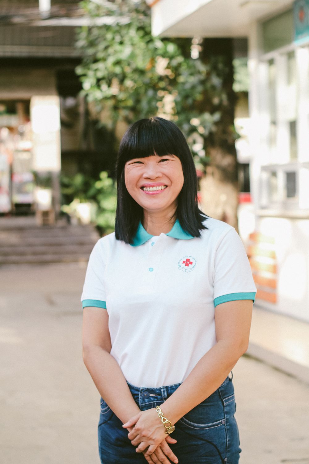 Woman wearing a white polo shirt for casual and uniform use
