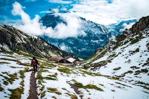 Person Walking on Mountain Area