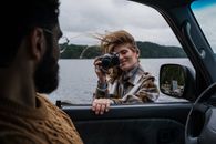 Woman in Brown and Beige Jacket Holding Black Dslr Camera