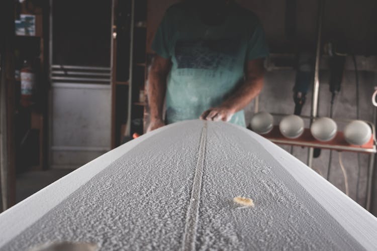 Crop Artisan Shaping Surfboard In Workshop