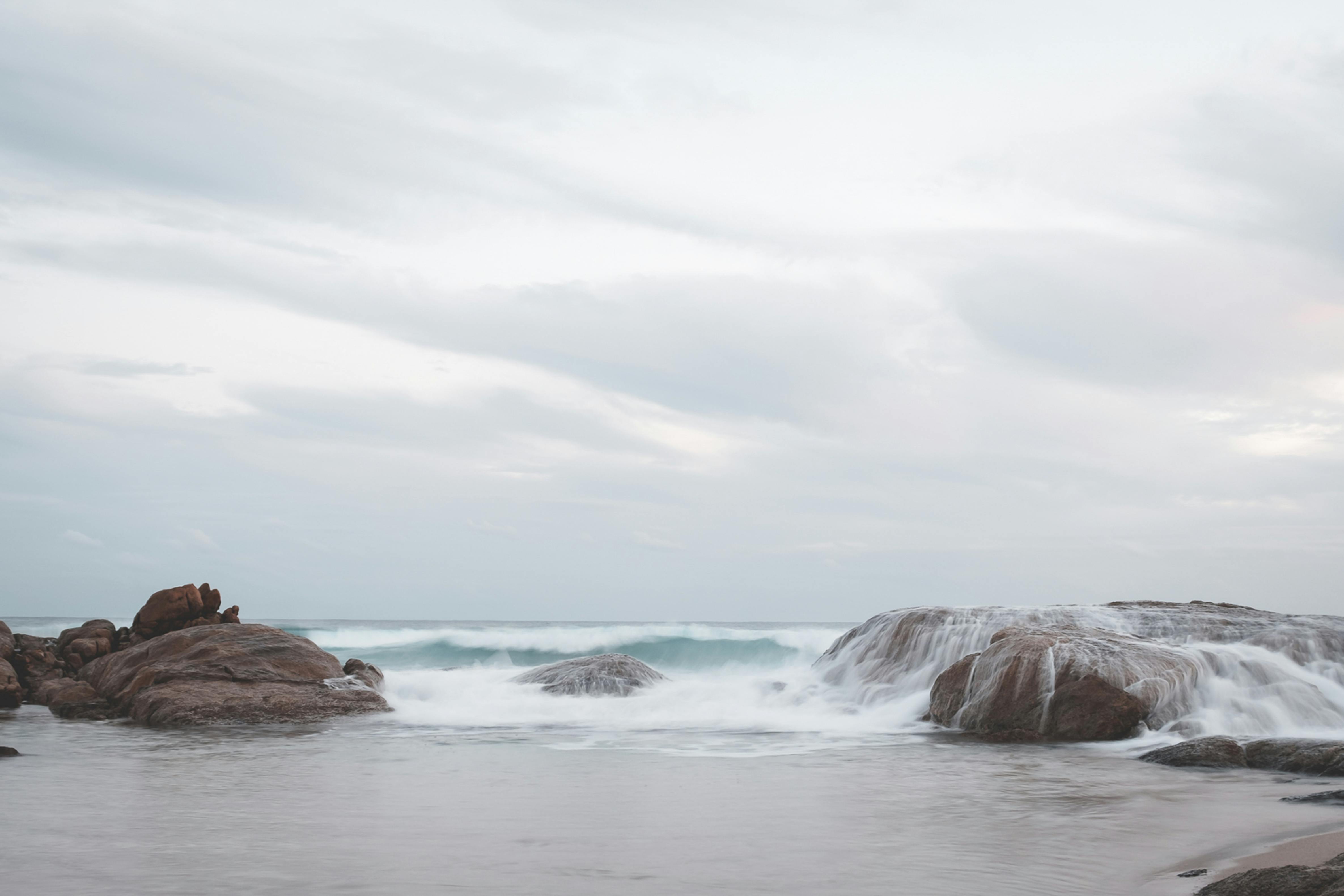 rocky formations with waving sea