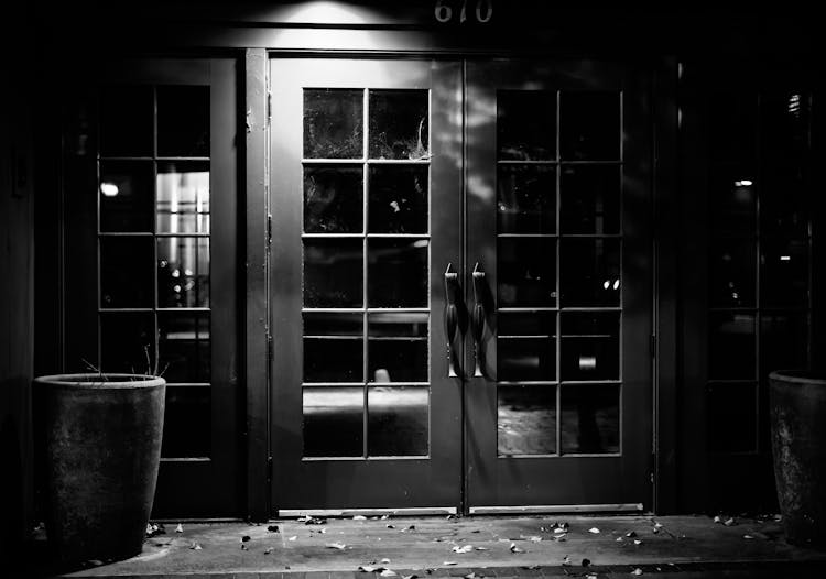 Closed Pub With Glass Door In Light Of Lamp