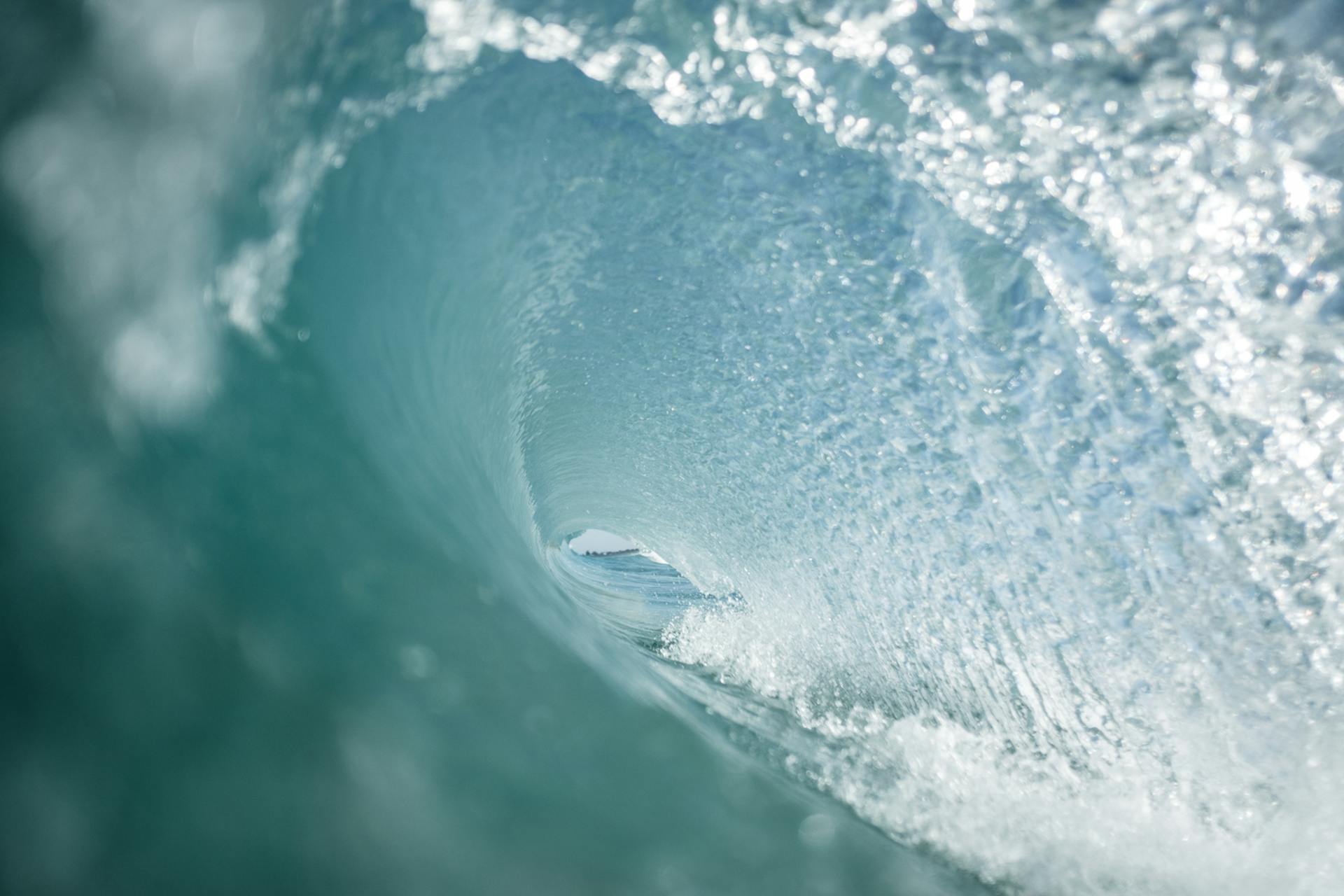 View from swirling fast wave of powerful transparent blue ocean in tropical country