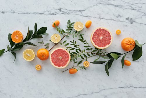 Sliced Fruits on Granite Surface