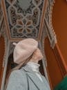 Woman in beret enjoying ornamental house