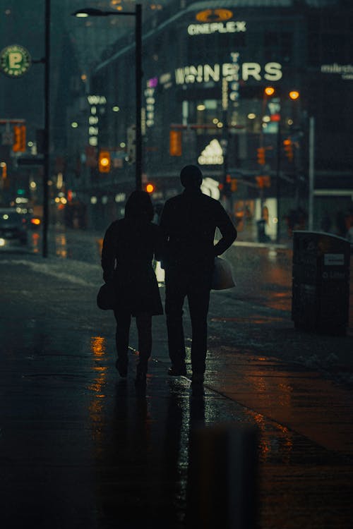 A Couple Walking at Night