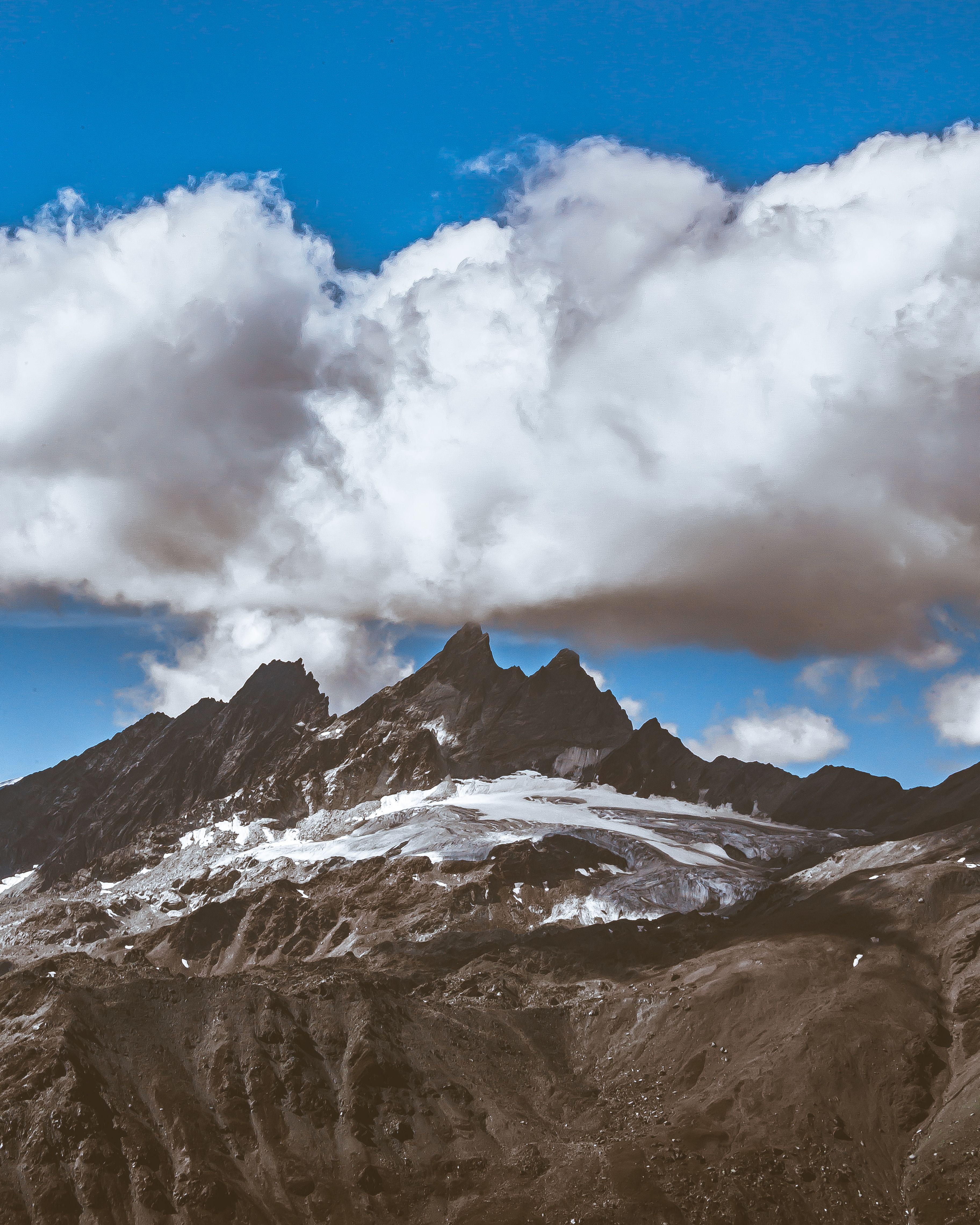 Rocky Mountain Under Cloudy Sky · Free Stock Photo