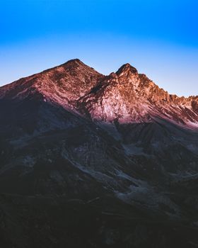 Capture the breathtaking beauty of the Swiss Alps with this stunning mountain landscape at sunrise.