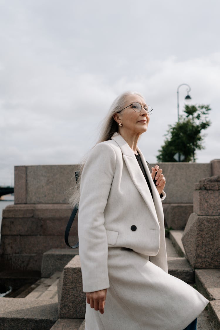 Elderly Woman Going Up Stairs