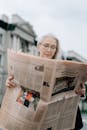 Elderly Woman Reading a Newspaper