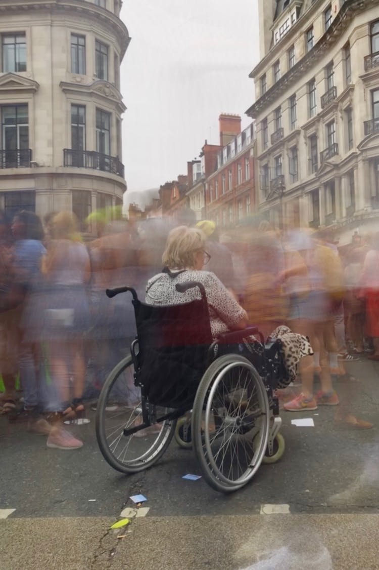 A Woman Sitting On The Wheelchair